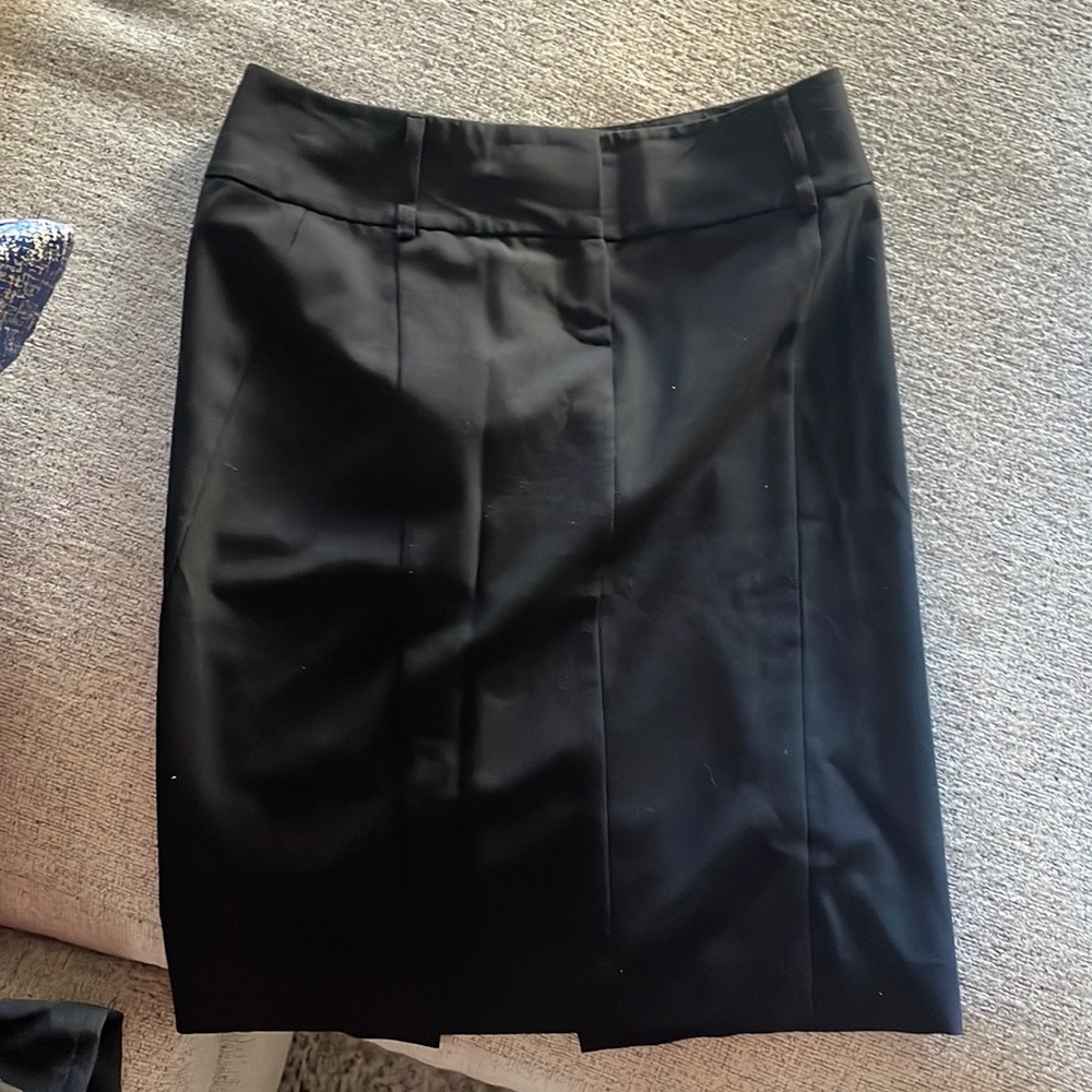 Express black slit pencil skirt with Leapord inseam. $25. Size 0